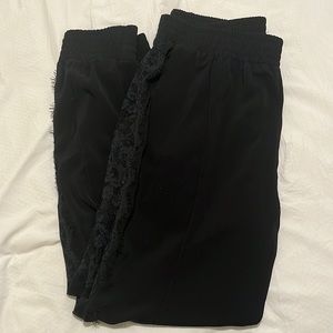 Black joggers with lace side details